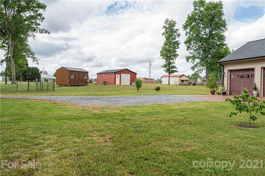 4773 Grigg Road Lincolnton, NC 28092 - Photo 29 of 34 a front view of a house with a yard and trees