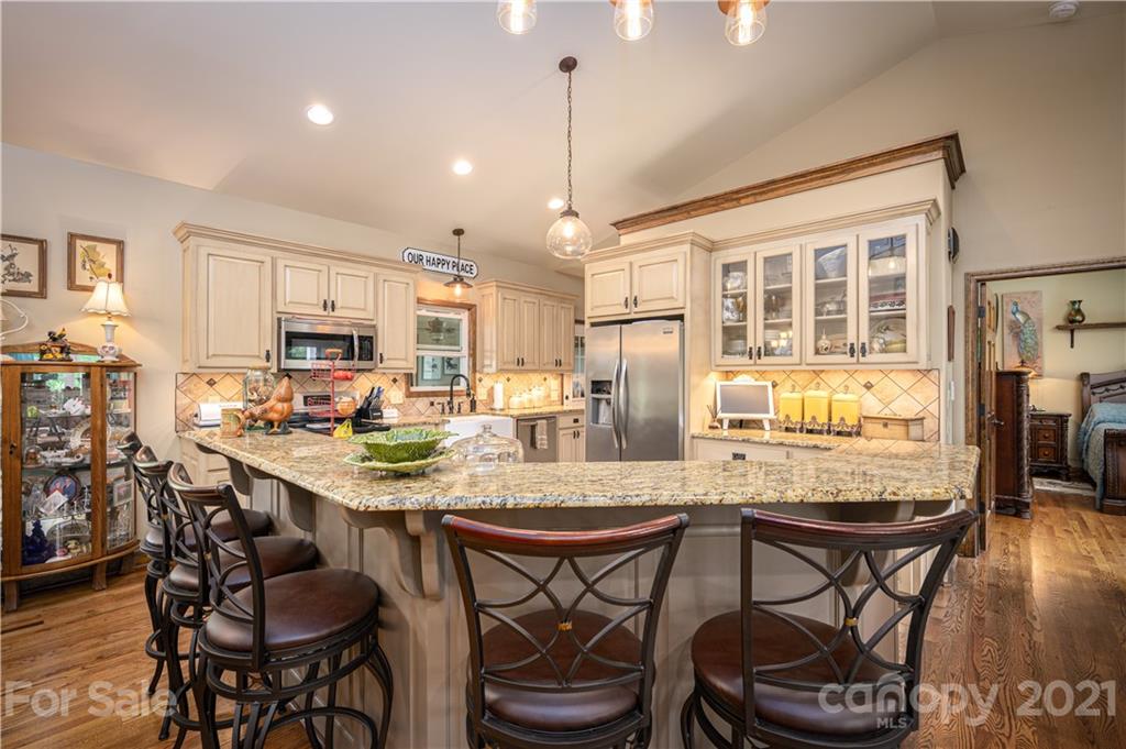 4773 Grigg Road Lincolnton, NC 28092 - Photo 6 of 34 a view of a dining room with furniture window and wooden floor