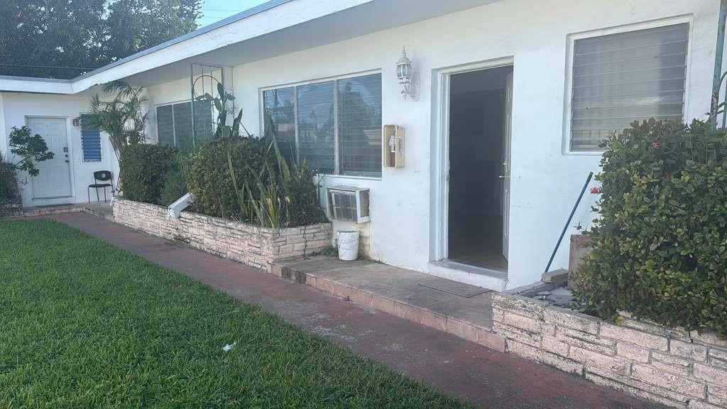 750 83rd Street, Unit 3 Miami Beach, FL 33141 - Photo 1 of 31 a view of a house with backyard and a garden