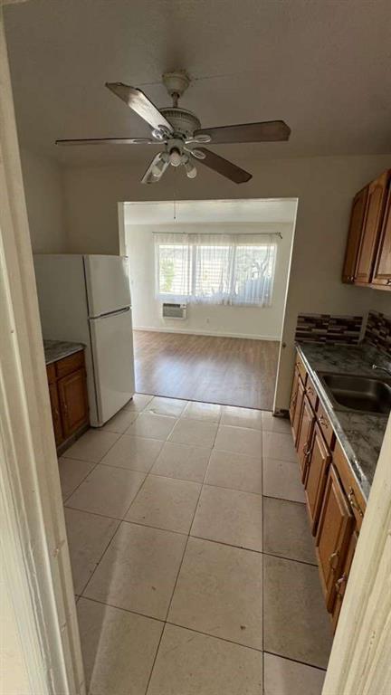 750 83rd Street, Unit 3 Miami Beach, FL 33141 - Photo 12 of 31 a kitchen with a stove a refrigerator and a stove top oven