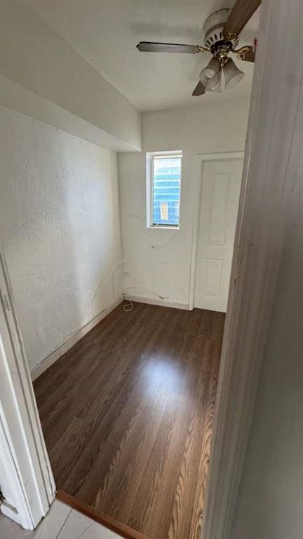 750 83rd Street, Unit 3 Miami Beach, FL 33141 - Photo 14 of 31 an empty room with wooden floor fan and windows