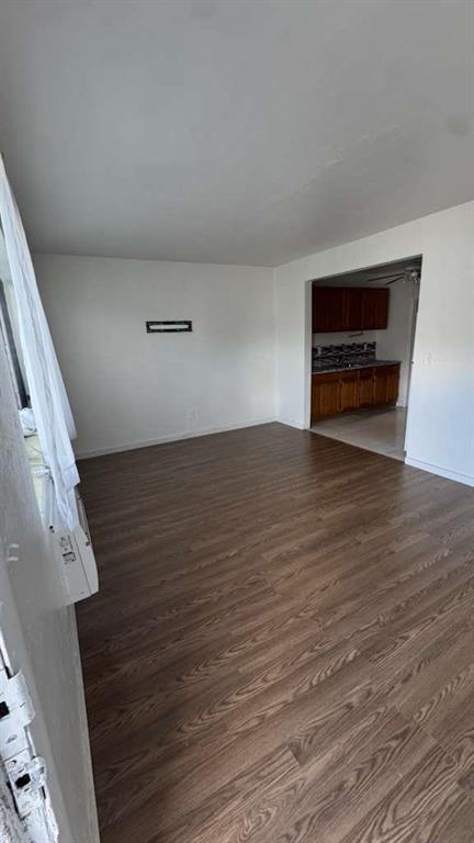 750 83rd Street, Unit 3 Miami Beach, FL 33141 - Photo 17 of 31 a view of an empty room with wooden floor and a window
