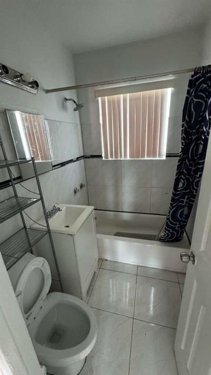 750 83rd Street, Unit 3 Miami Beach, FL 33141 - Photo 19 of 31 a bathroom with a toilet and shower
