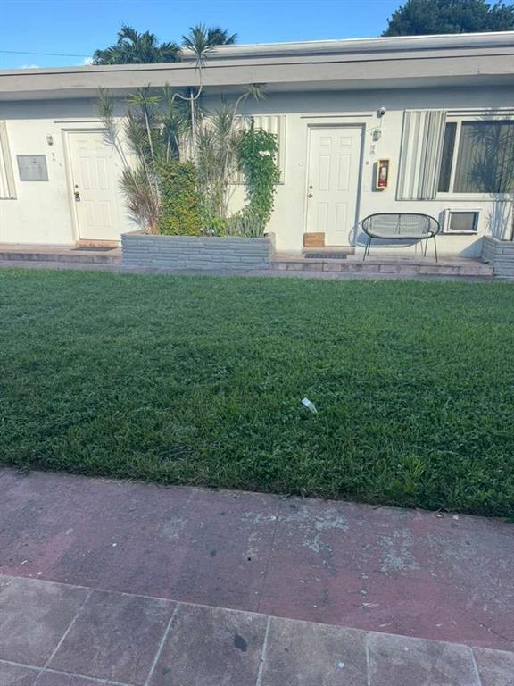 750 83rd Street, Unit 3 Miami Beach, FL 33141 - Photo 20 of 31 a view of backyard with a garden and plants