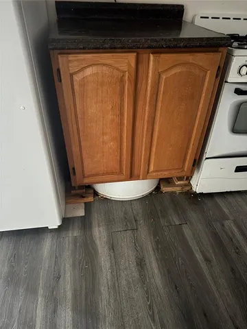 a view of a room with wooden floor