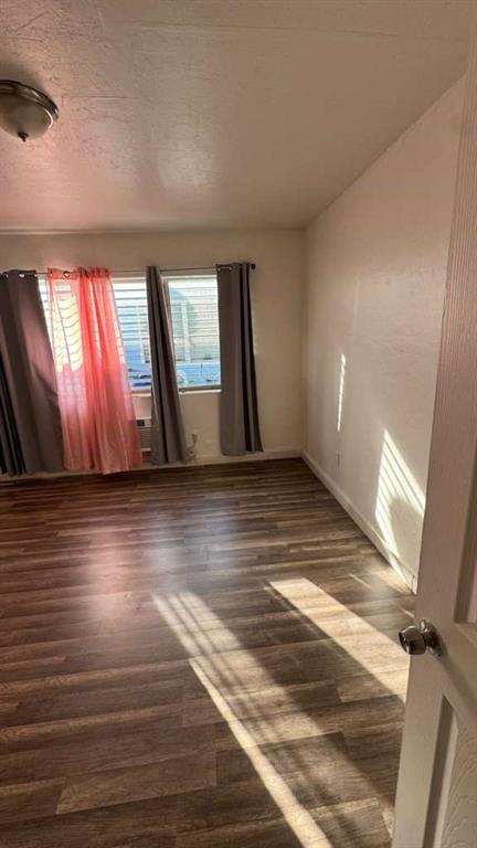 750 83rd Street, Unit 3 Miami Beach, FL 33141 - Photo 5 of 31 a view of room with window and wooden floor