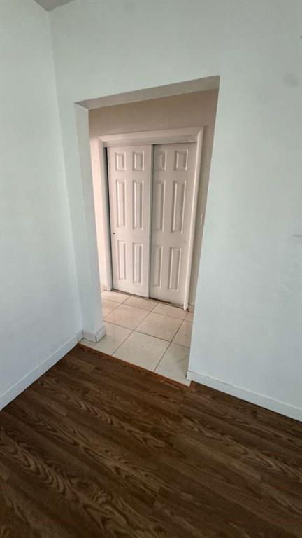 750 83rd Street, Unit 3 Miami Beach, FL 33141 - Photo 10 of 31 an empty room with wooden floor and windows