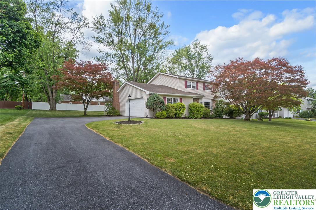 268 Apollo Drive Bethlehem, PA 18017 - Photo 46 of 56 A welcoming suburban home sets back with a generous paved driveway.