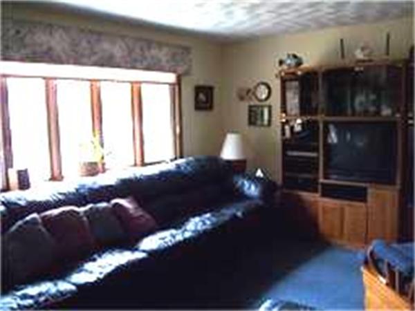 133 Howland Road Freetown, MA 02702 - Photo 9 of 25 a living room with furniture and wooden floor