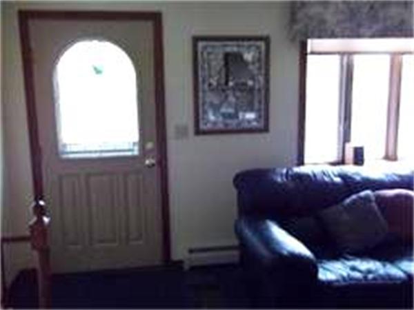 133 Howland Road Freetown, MA 02702 - Photo 10 of 25 a living room with a couch and a window