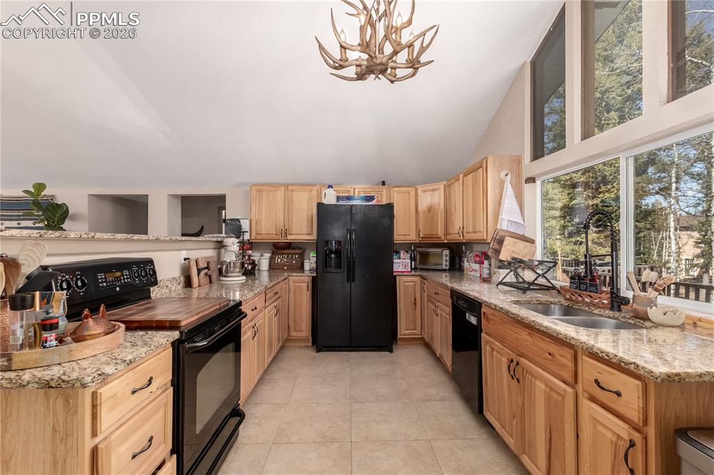 44 Anderson Road Florissant, CO 80816 - Photo 12 of 31 a kitchen with a sink stove and refrigerator