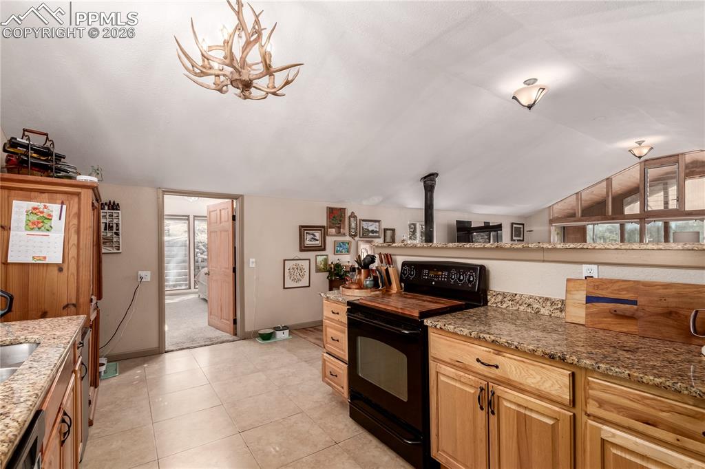 44 Anderson Road Florissant, CO 80816 - Photo 13 of 31 a kitchen with stainless steel appliances granite countertop a stove and a sink