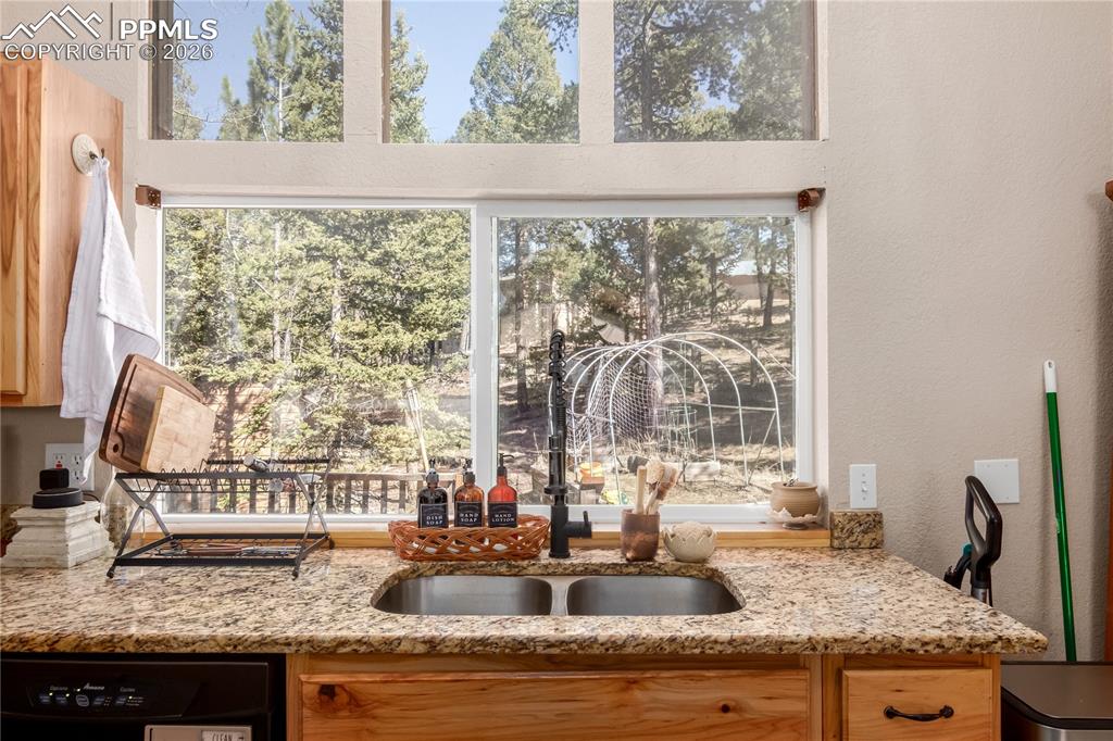 44 Anderson Road Florissant, CO 80816 - Photo 15 of 31 a kitchen with granite countertop a sink and a window