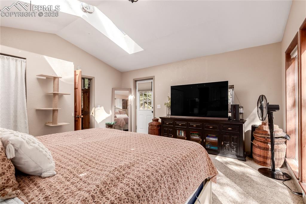 44 Anderson Road Florissant, CO 80816 - Photo 17 of 31 a bedroom with a bed and a flat screen tv