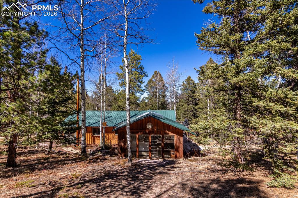 44 Anderson Road Florissant, CO 80816 - Photo 30 of 31 a view of a house with a yard