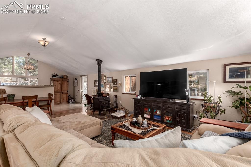 44 Anderson Road Florissant, CO 80816 - Photo 8 of 31 a living room with furniture a flat screen tv and a large window