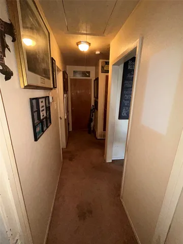 a view of a house with a large tree