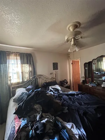 a bathroom with a sink toilet next to a window