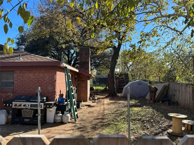 a view of a backyard with sitting area and furniture