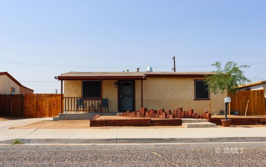 333 North Helena Street Ridgecrest, CA 93555 - Photo 4 of 35 a view of a house with a balcony and outdoor space