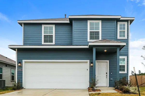a front view of a house with a garage