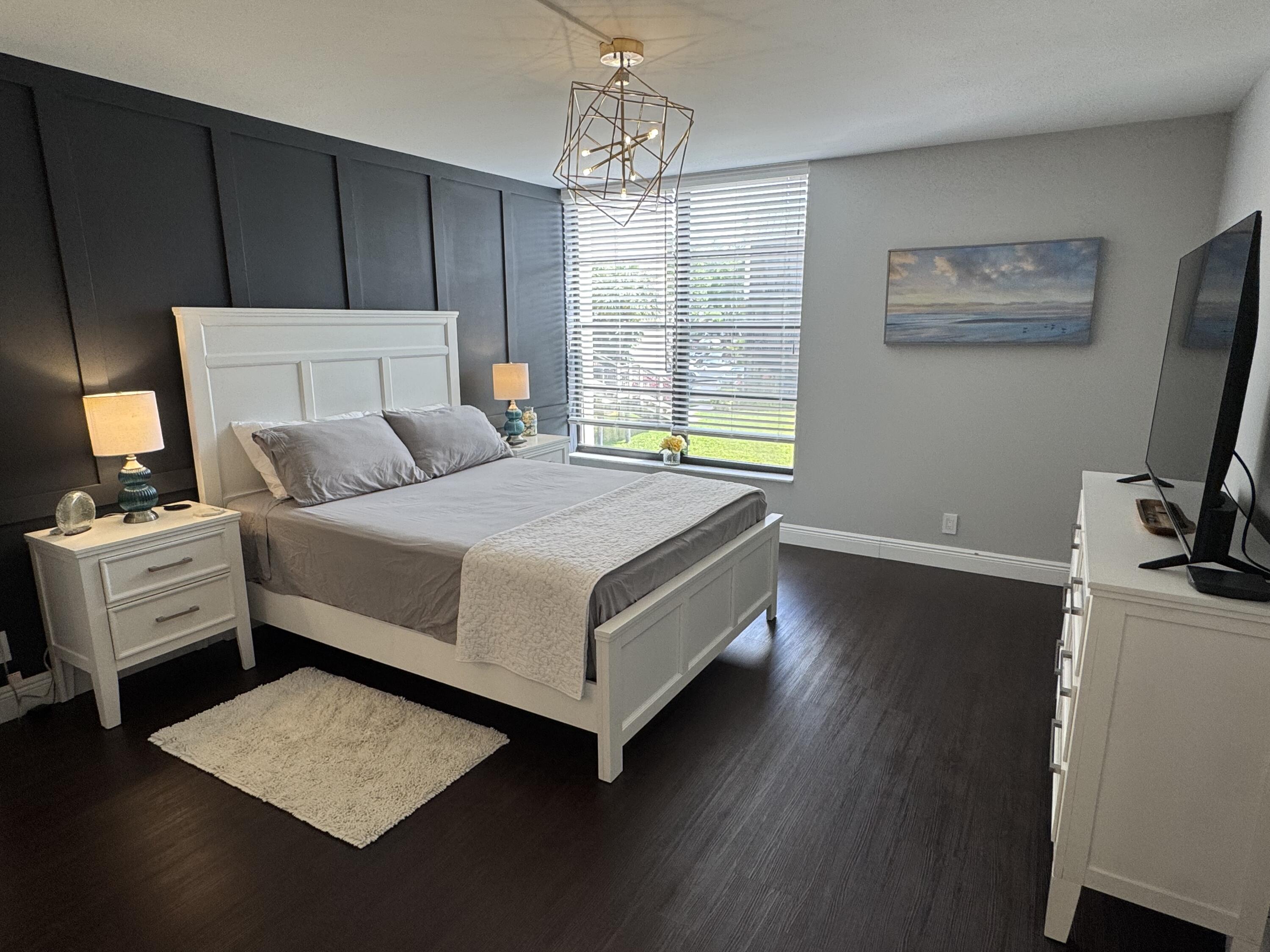 6 Royal Palm Way, Unit 202 Boca Raton, FL 33432 - Photo 5 of 29 a bed room with a bed and a window