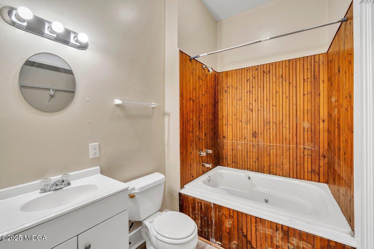 1873 Hardeman Avenue Macon, GA 31201 - Photo 17 of 25 a bathroom with a sink a toilet and shower