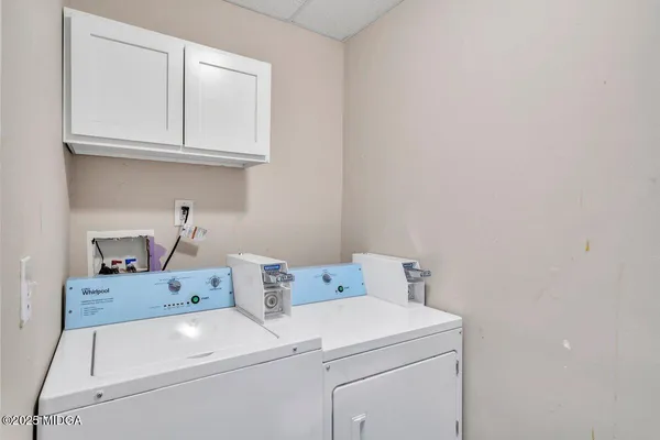 a utility room with dryer and washer