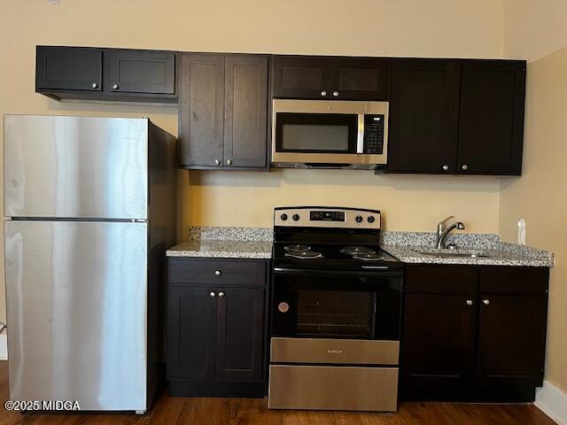 1873 Hardeman Avenue Macon, GA 31201 - Photo 22 of 25 a kitchen with a refrigerator and a stove