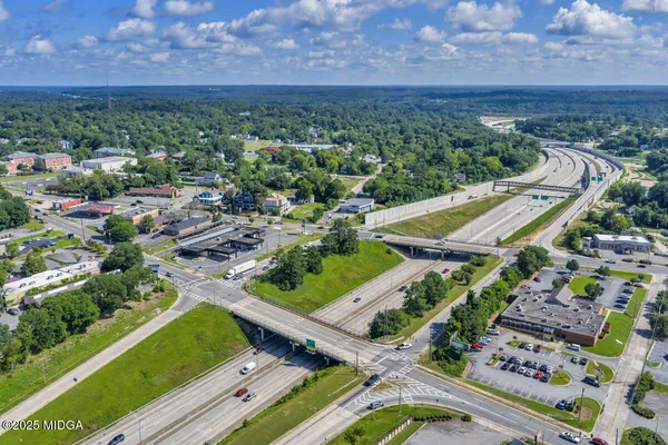 an aerial view of a residential houses with outdoor space