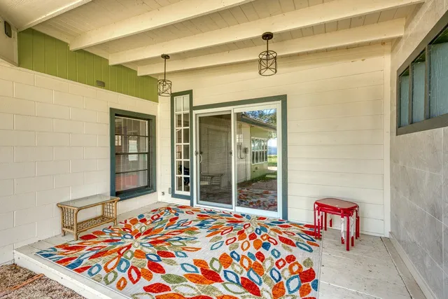 a bedroom with a bed and a table