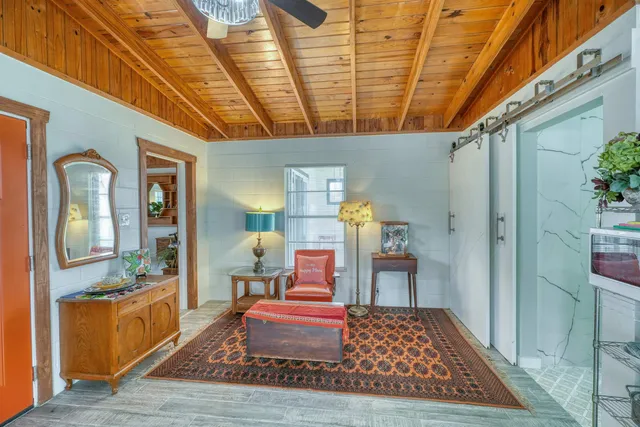 a living room with furniture and a rug
