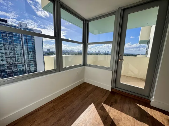 a view of a hallway with two chairs