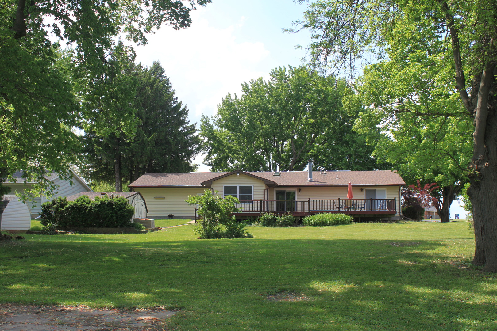 12892 Lawrence Road Sterling, IL 61081 - Photo 14 of 29 a front view of a house with a garden