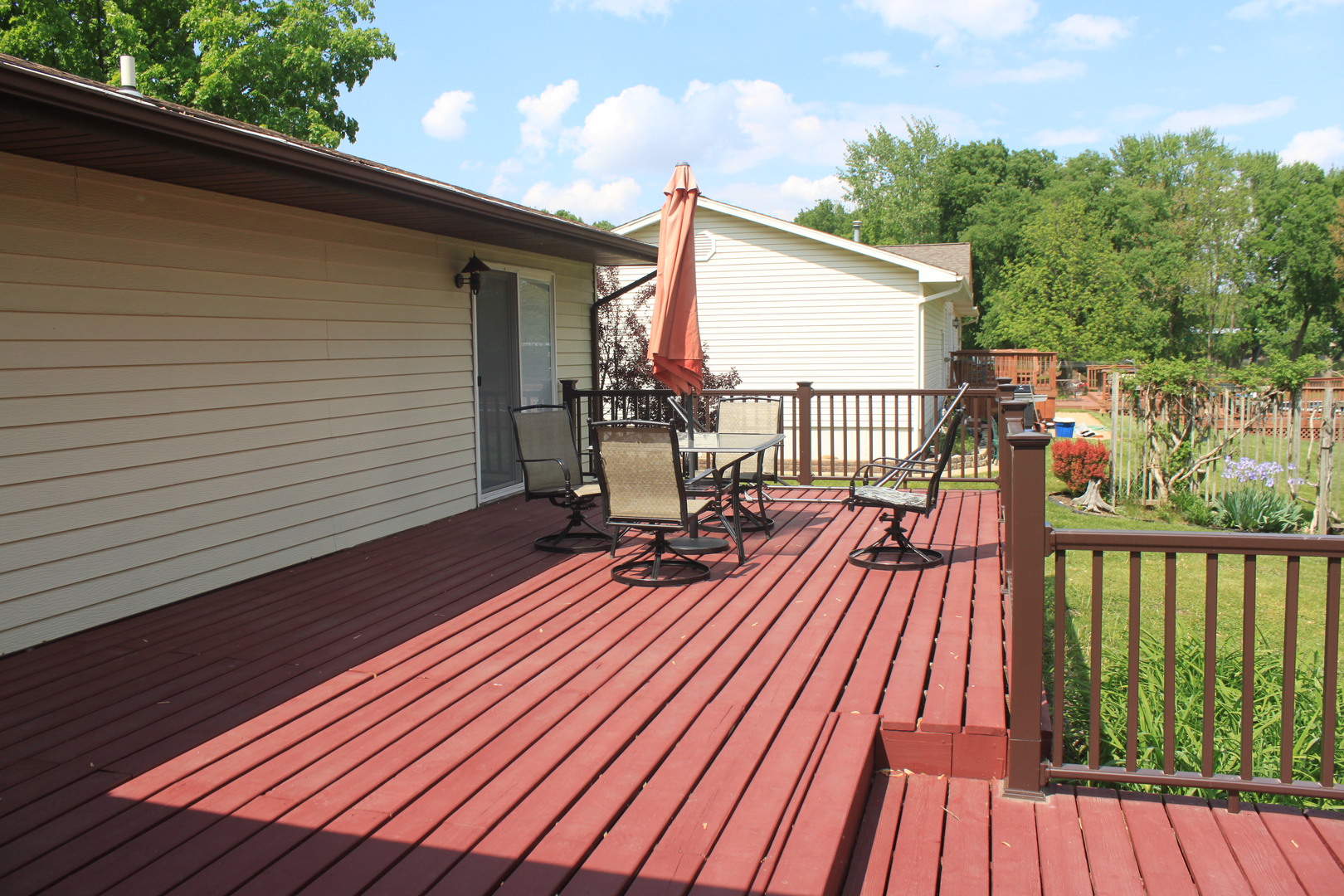 12892 Lawrence Road Sterling, IL 61081 - Photo 17 of 29 a view of balcony with wooden floor and outdoor seating