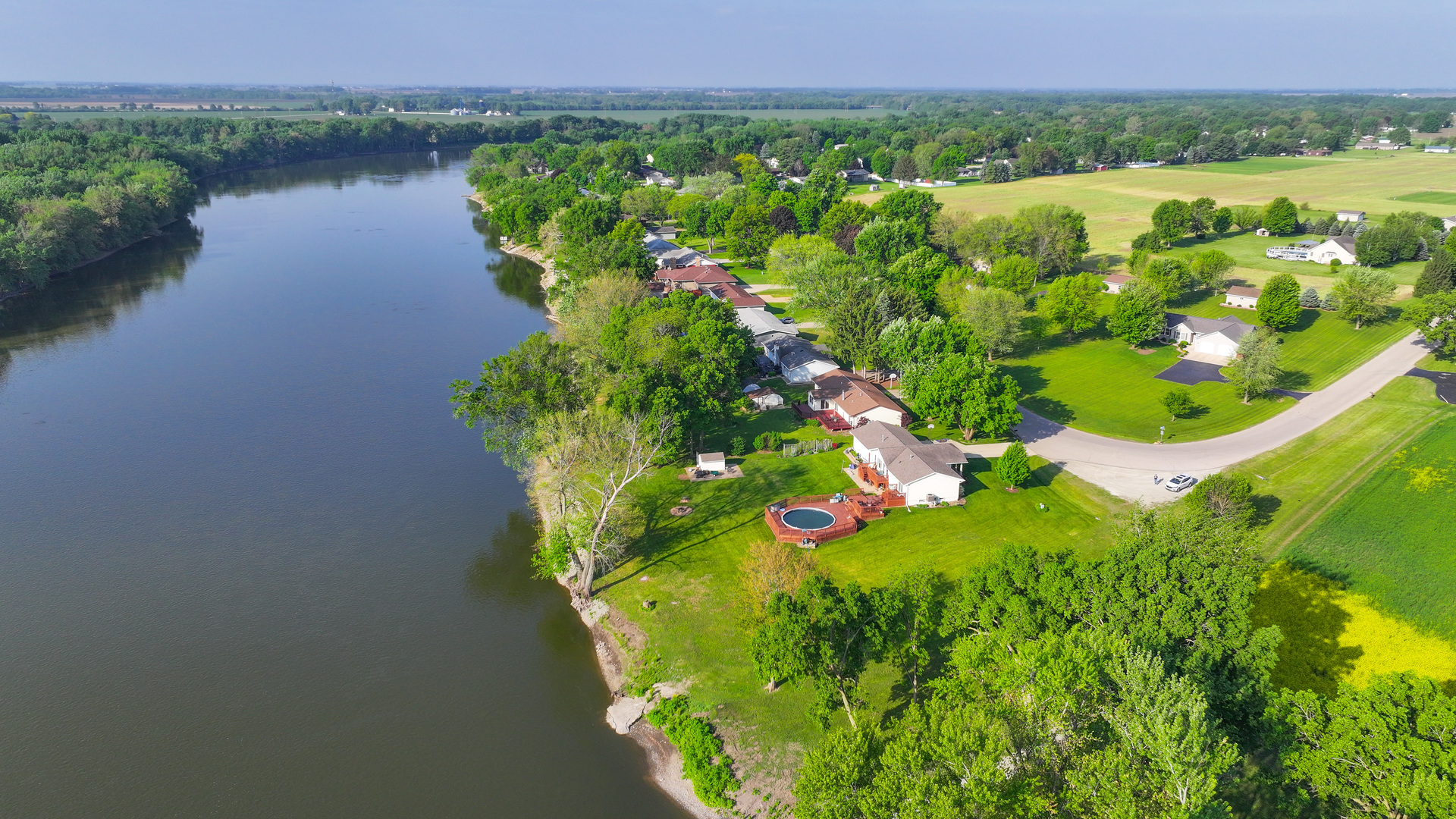 12892 Lawrence Road Sterling, IL 61081 - Photo 24 of 29 a view of a lake with a mountain in the background