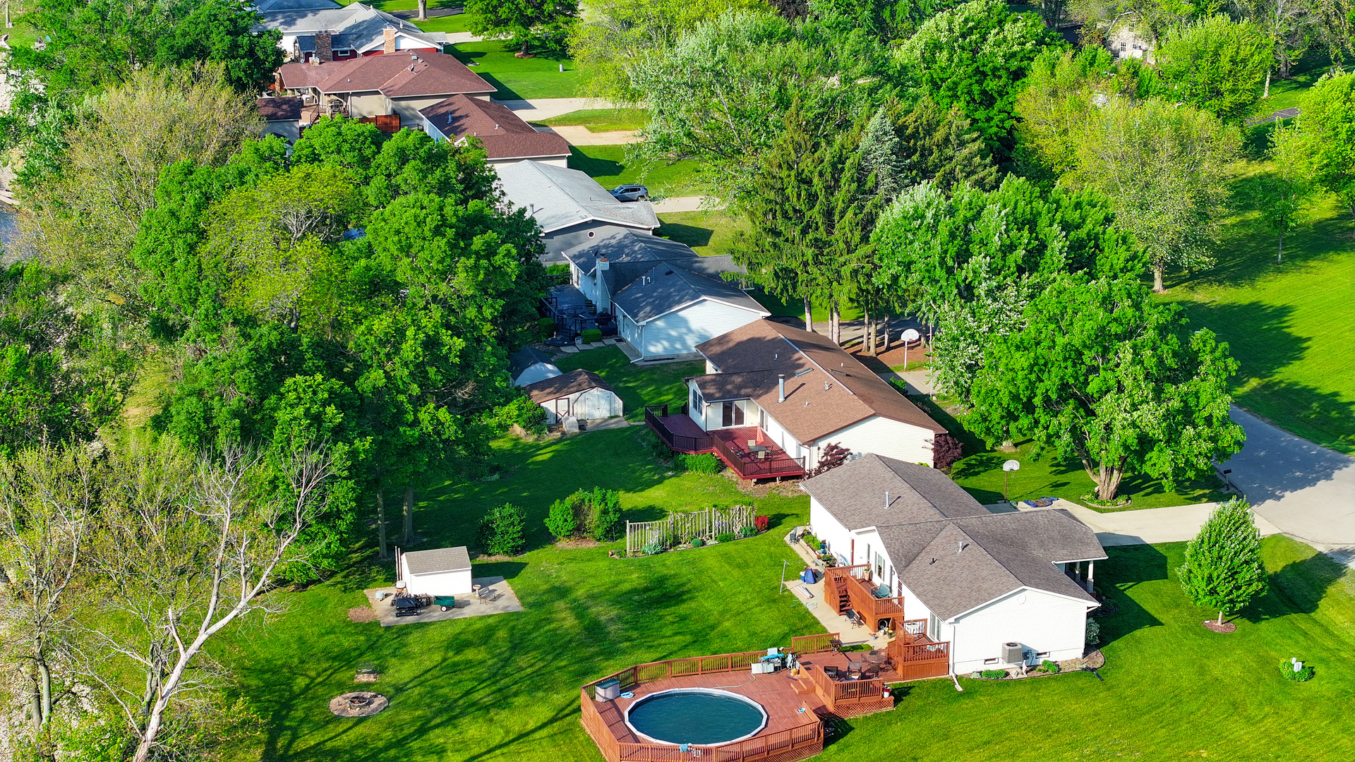 12892 Lawrence Road Sterling, IL 61081 - Photo 25 of 29 an aerial view of residential house with outdoor space and trees all around
