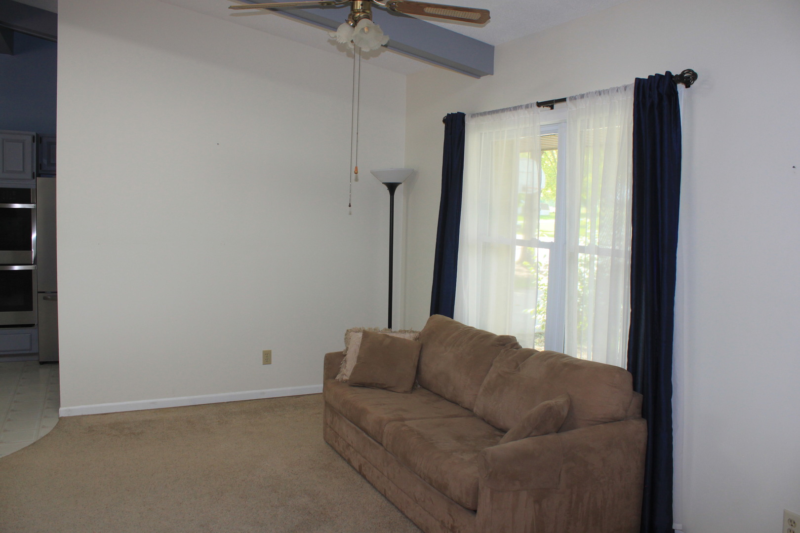 12892 Lawrence Road Sterling, IL 61081 - Photo 5 of 29 a living room with furniture and a large window