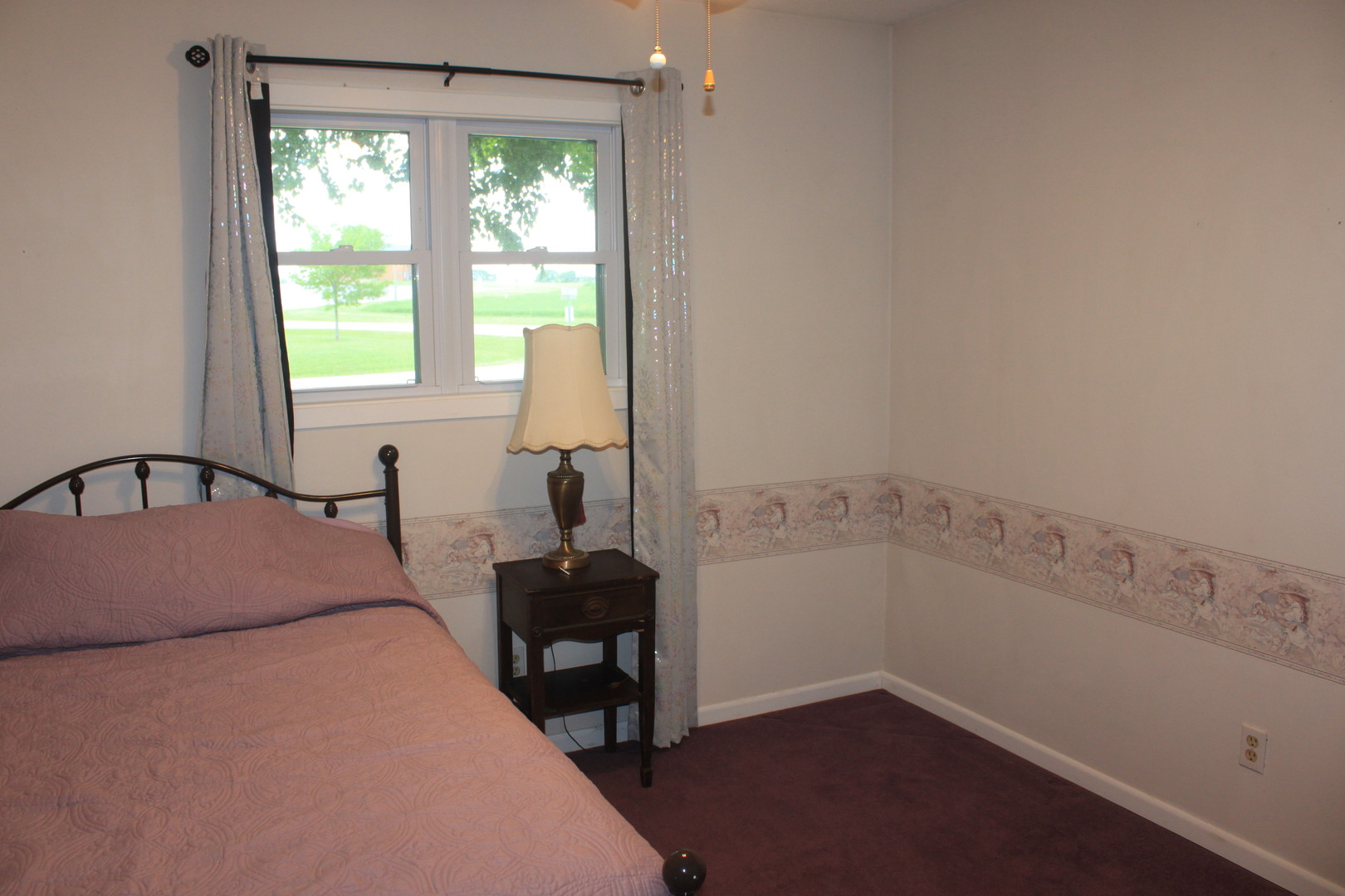 12892 Lawrence Road Sterling, IL 61081 - Photo 10 of 29 a bedroom with a bed and a window