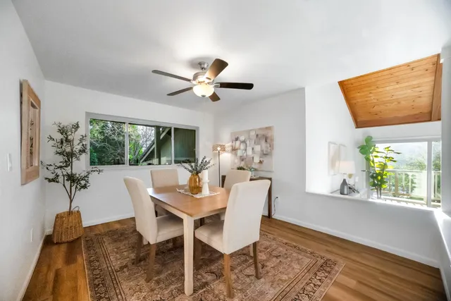 a dining room with a table and chairs