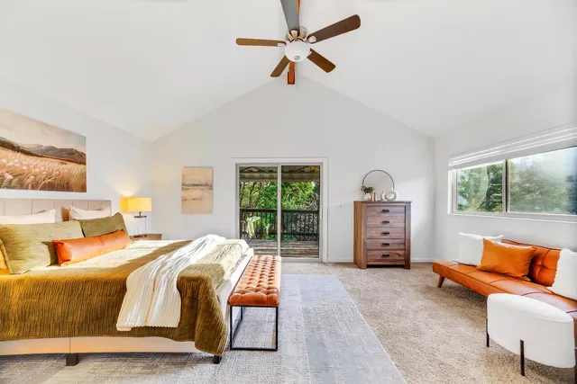 a bedroom with bed and window