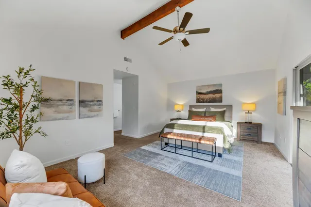 a bedroom with a bed and window