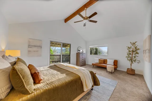 a spacious bathroom with a double vanity sink a mirror and a bathtub