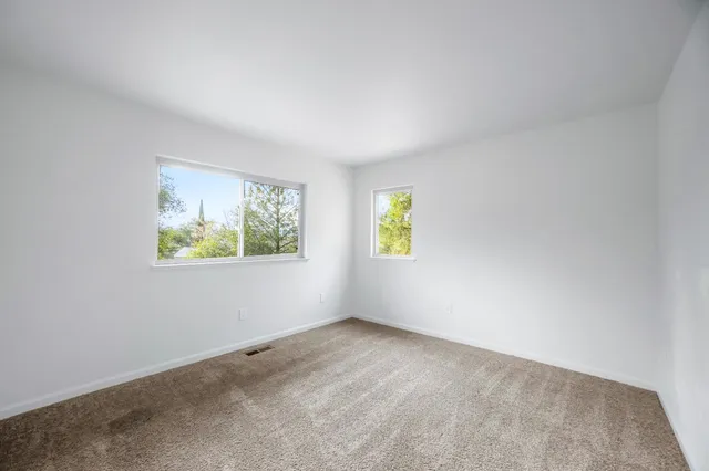 a bathroom with a toilet a sink and a mirror