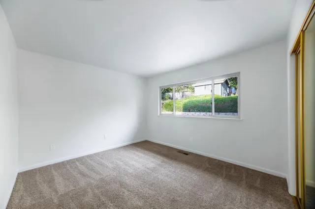 a view of livingroom with hardwood floor and a ceiling fan