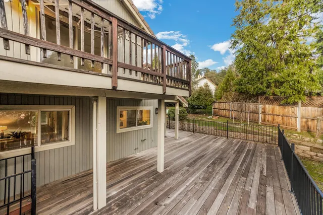 a view of a white house with a yard