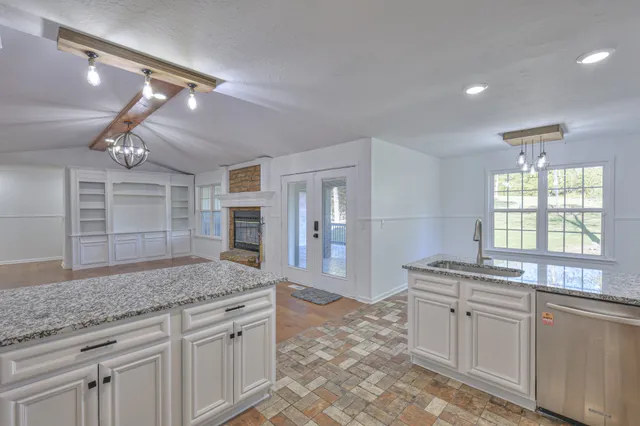 an empty room with a empty space and a ceiling fan