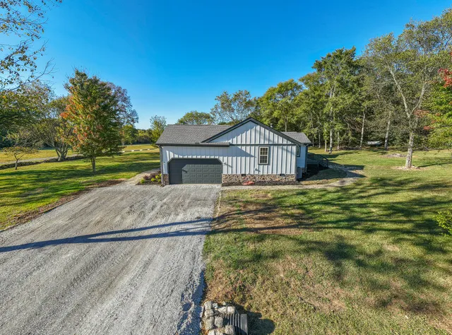 a view of a kitchen with a sink and a refrigerator