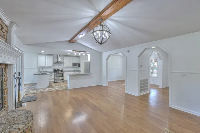 a kitchen with a sink stove and refrigerator