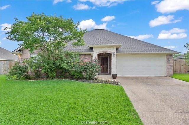 2616 Colony Vista Drive Bryan, TX 77808 - Photo 1 of 1 a front view of a house with a yard and garage